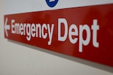 A photo of a red hospital emergency sign.