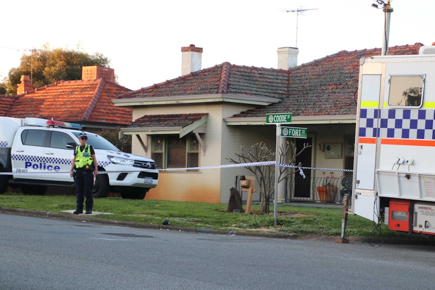 Police guard a house on Coode Street in Bedford, Perth's north-eastern suburbs, where five people were found dead.