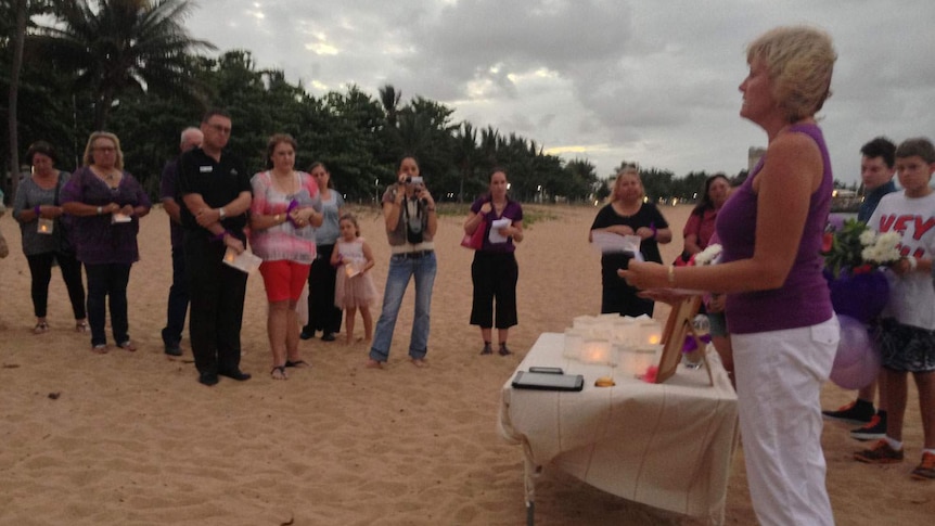 People gathered at memorial service on Townsville beach in north Qld for Tina Watson