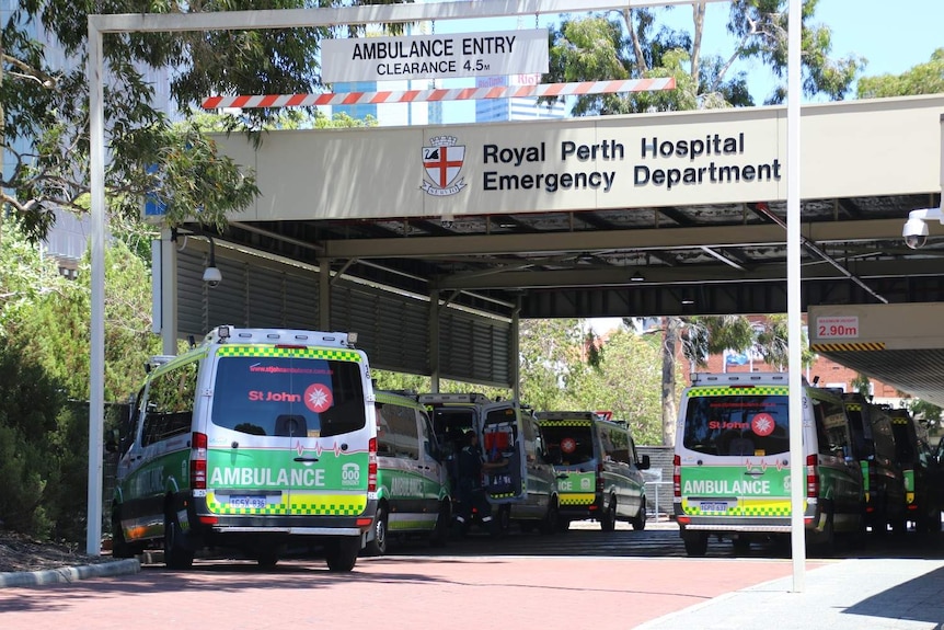 Dozens of ambulances queueing outside a hospital.