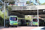 Dozens of ambulances queueing outside a hospital.