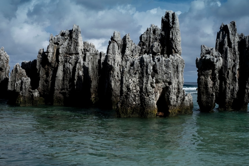 rocky spikes come out of water