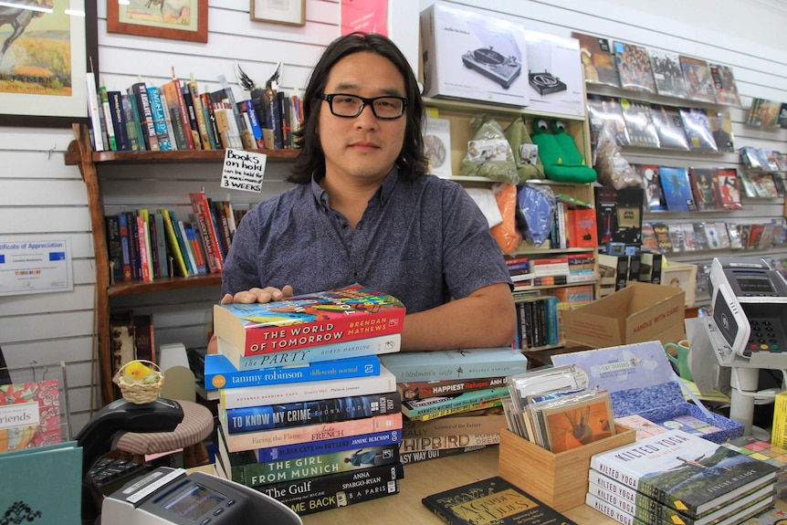 Man standing with books