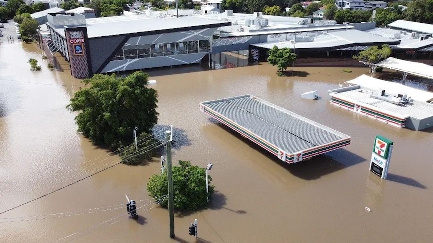 Floodwaters rise to the roof of a Coles supermarket.