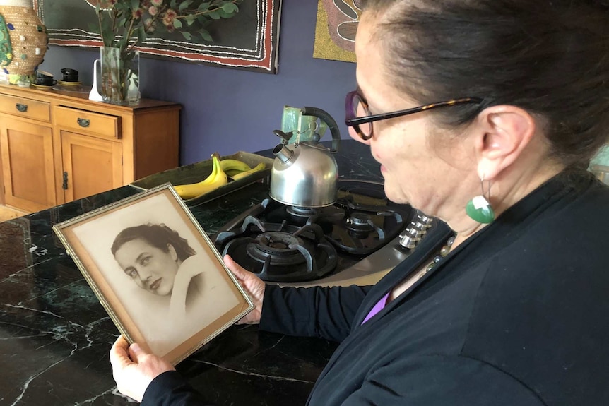 Jenna Price looks at the photo of mother, a Holocaust survivor who came to Australia from Czechoslovakia as a migrant.