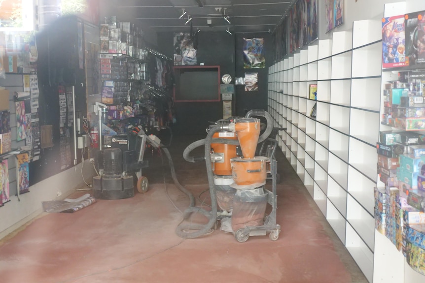 A generator sits inside a small shop.