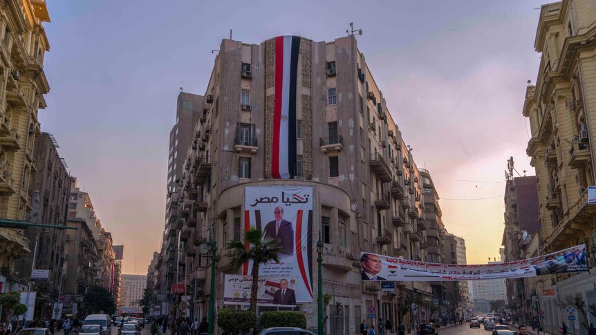 Posters of Egypt president Sisi are seen on a building in downtown Cairo.