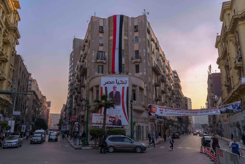 Posters of Egypt president Sisi are seen on a building in downtown Cairo.