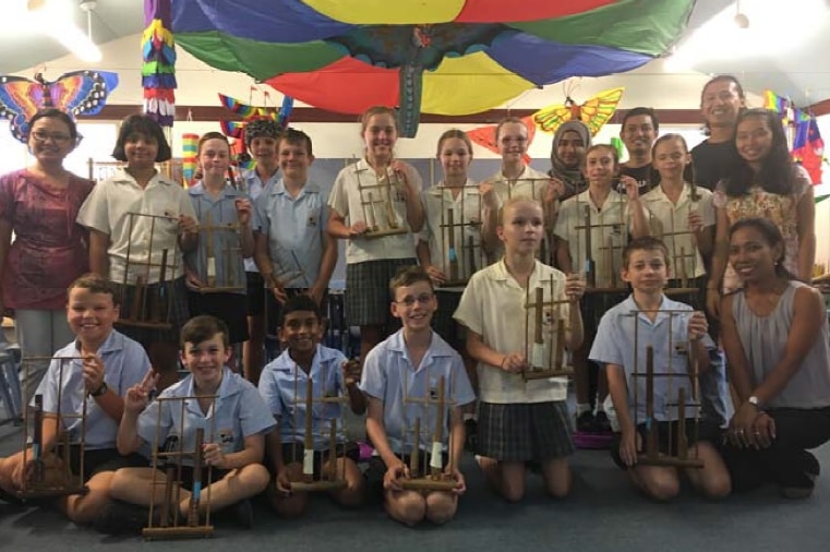 Students with Angklung musical instruments from Indonesia during a class at Townsville Grammar School.
