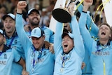 England players celebrate as confetti rains down and Eoin Morgan raises the Cricket World Cup trophy