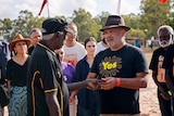 Balupalu Yunupingu explains the importance of the message stick before handing it over to Noel Pearson.