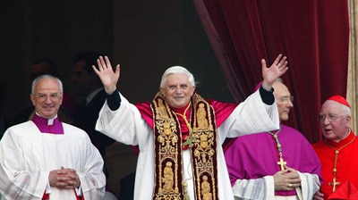 Pope Benedict XVI, Cardinal Joseph Ratzinger of Germany, waves from a balcony in the Vatican.