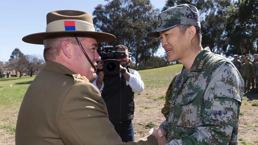 Brigadier Cameron Purdey greets Senior Colonel Wang Jingguo