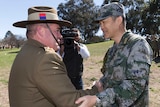 Brigadier Cameron Purdey greets Senior Colonel Wang Jingguo