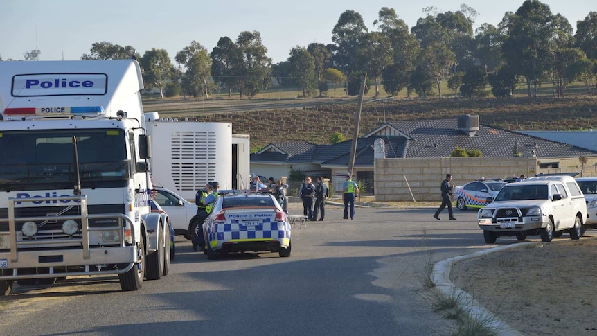 Police gather in Carabooda in Western Australia as part of an investigation into crime syndicates on May 3, 2014.