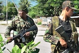 East Timorese soldiers patrol on the outskirts of Dili.