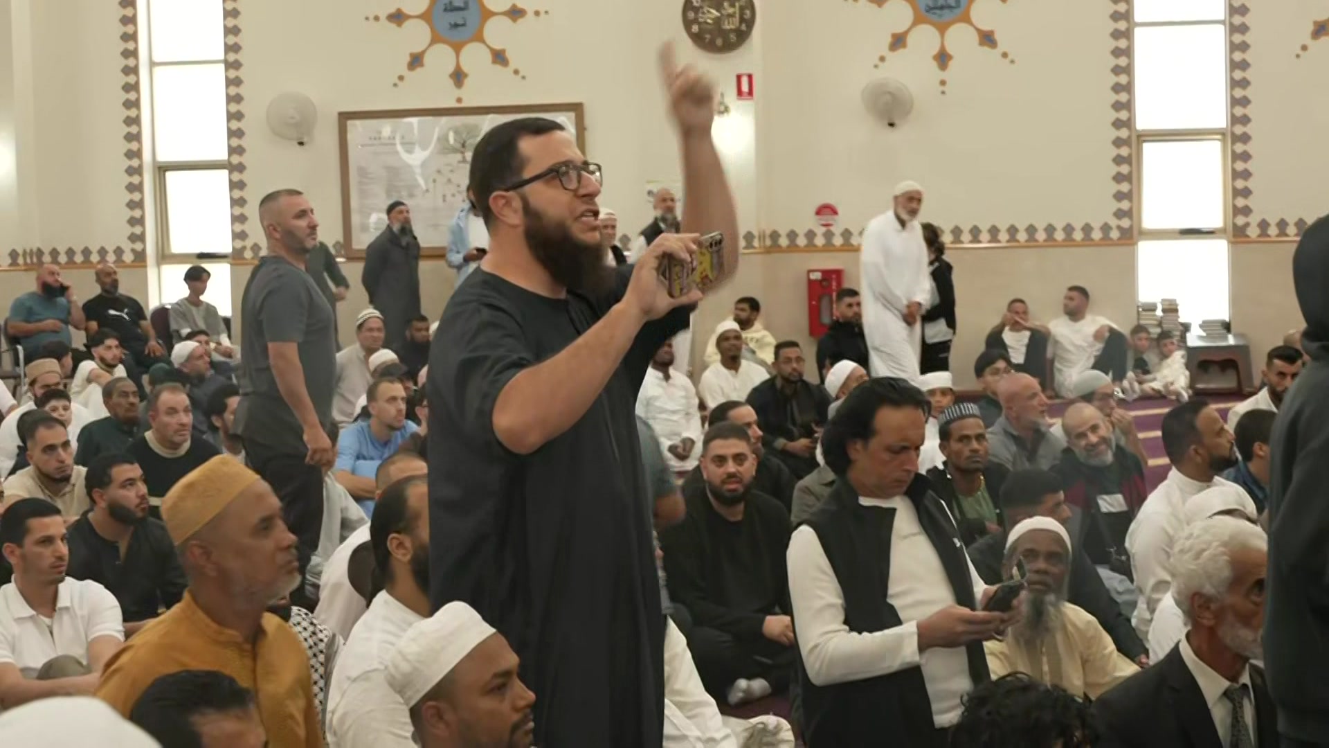 Men gathered at Islamic mosue. 