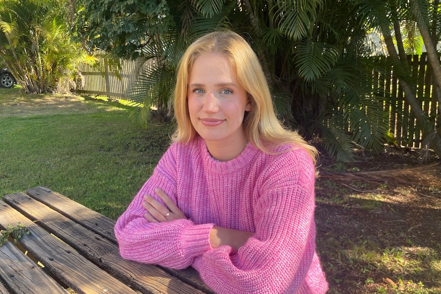 Kate Andersson sitting at a table outside in May 2023 