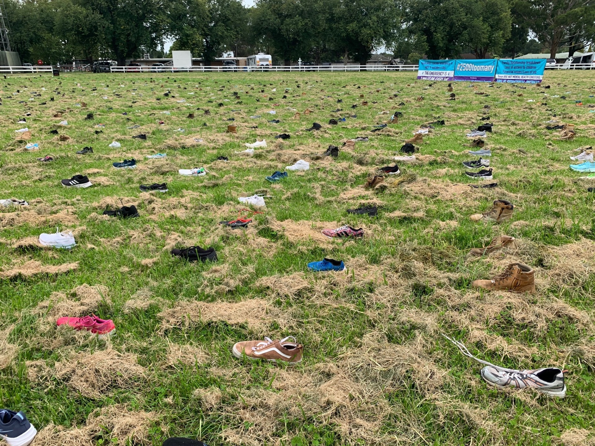 Sea of shoes spread out across oval.