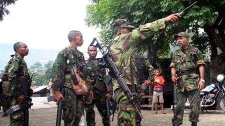 At least one soldier has been killed in shooting on the outskirts of Dili.