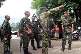 At least one soldier has been killed in shooting on the outskirts of Dili.