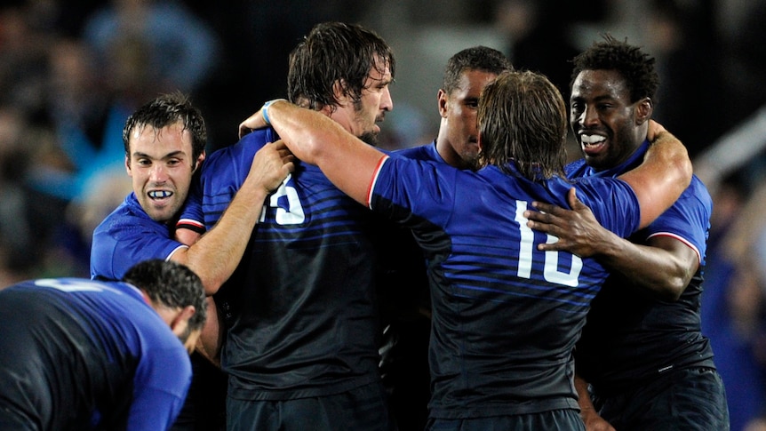 France players celebrate after winning the semi-final match against a 14-man Welsh outfit at Eden Park.