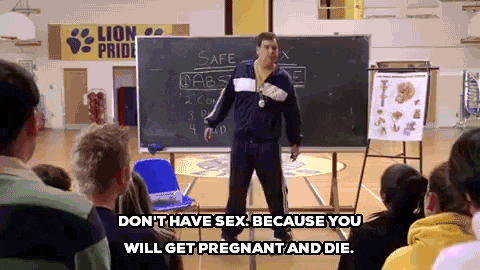 Physical education teacher stands in front of blackboard while saying 'don't have sex: because you will get pregnant and die'.