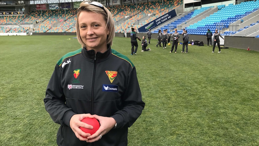 Sallianne Briggs, Head Coach for the female Tigers and Hurricanes teams, standing on Bellerive Oval