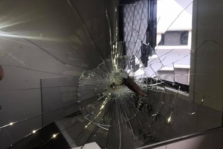 A shattered bathroom window in a Moranbah home