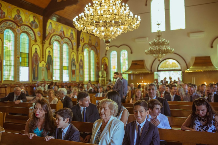 Wedding guests inside the St Eustathios Greek Orthodox Church