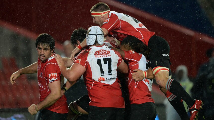 Lions players celebrate the winning try against the Bulls in Johannesburg.