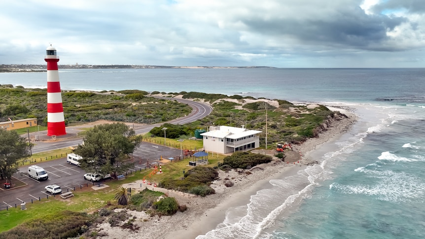 Aerial image showing a lighthouse, marine rescue building and coastline. 