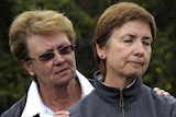 Elke Lapthorne, right, is comforted by her sister Barbara