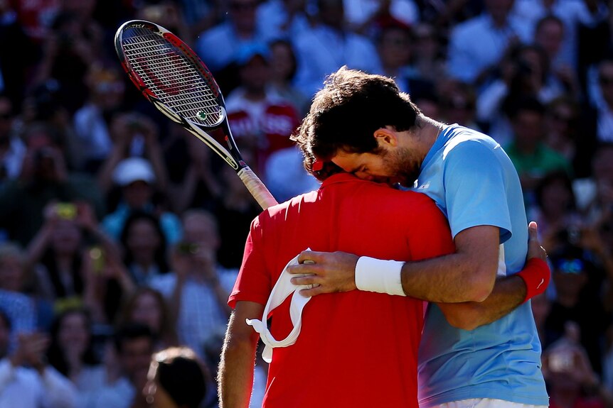 Marathon effort ... Roger Federer (L) fought back from the brink of defeat.