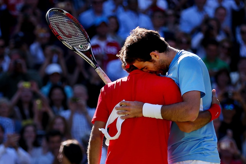 Marathon effort ... Roger Federer (L) fought back from the brink of defeat.