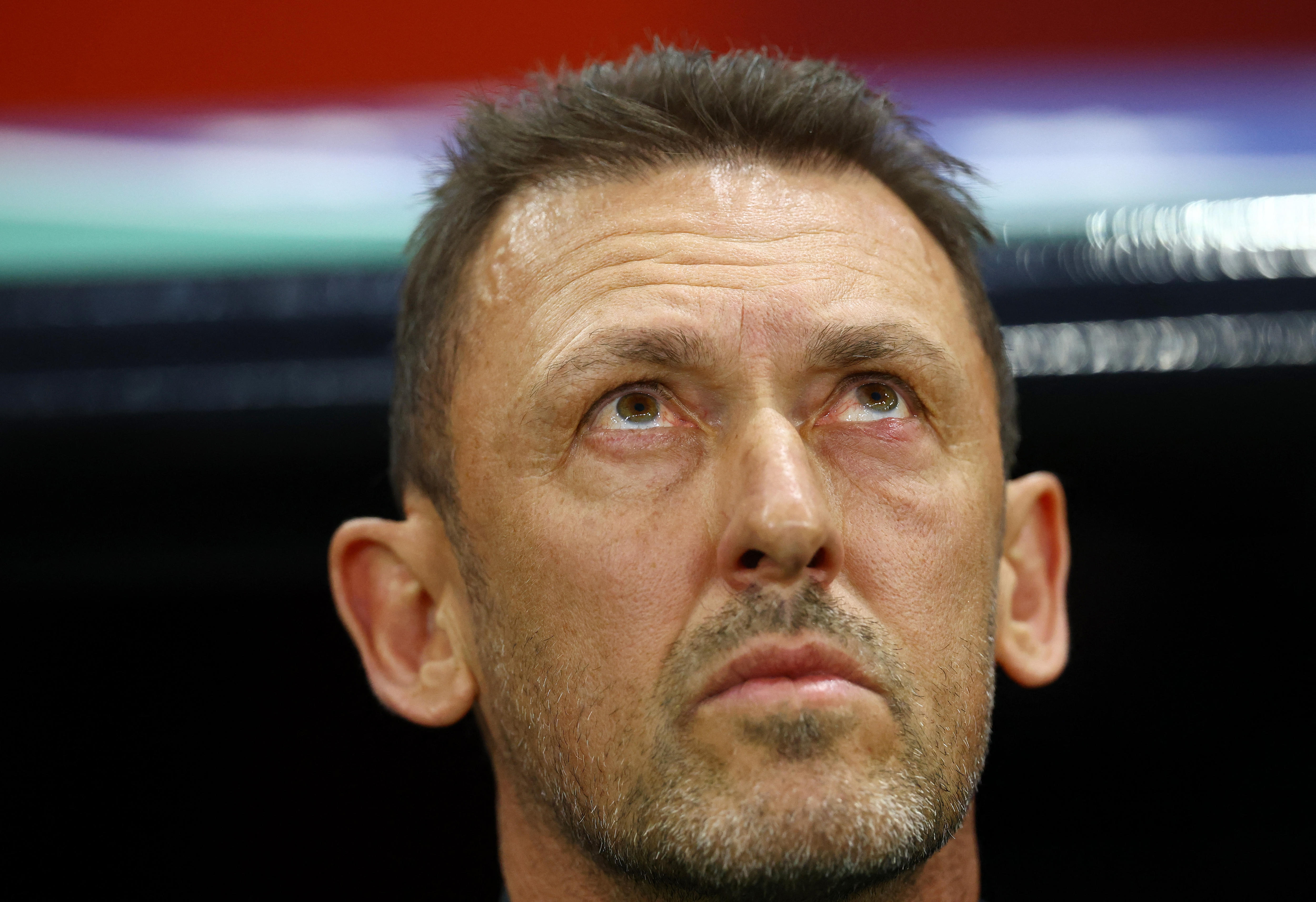 Australia coach Tony Popovic looks upward before a soccer match.