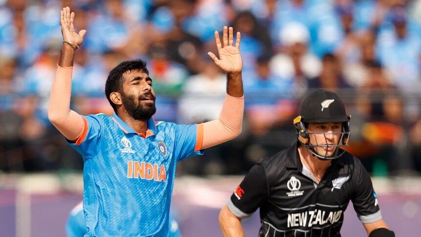 Jasprit Bumrah holds up his hands