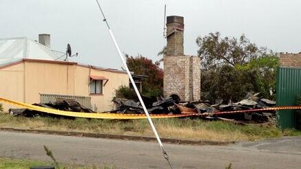 A chimney is the only thing left standing after a house caught on fire in Albany