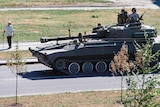 Tank carrying pro-Russian rebels into Donetsk in Ukraine