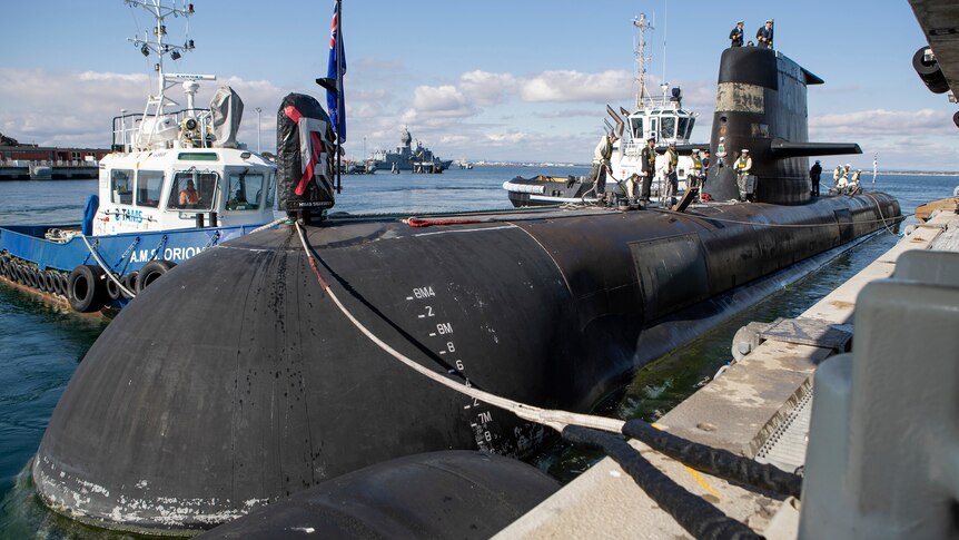 Submarine docked to a port. 