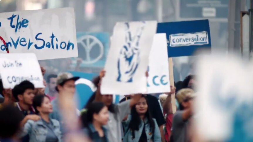 Protest signs in Pepsi ad
