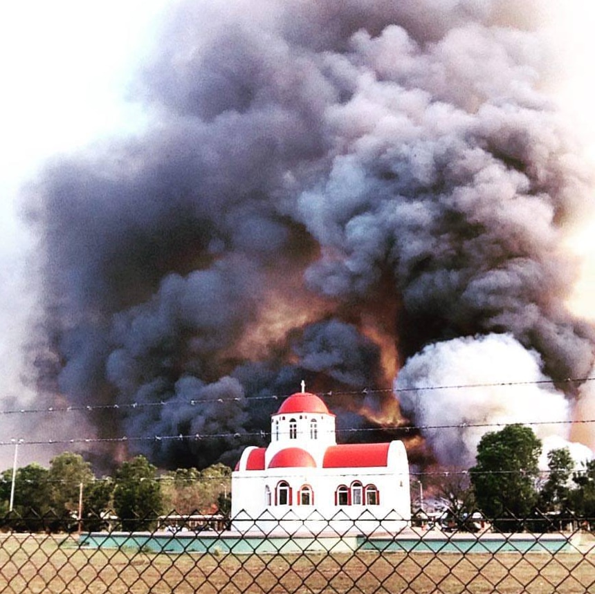 Fire burning near Greek orthodox chapel