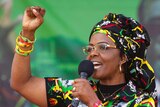 Grace Mugabe raises her first as she addresses supporters.