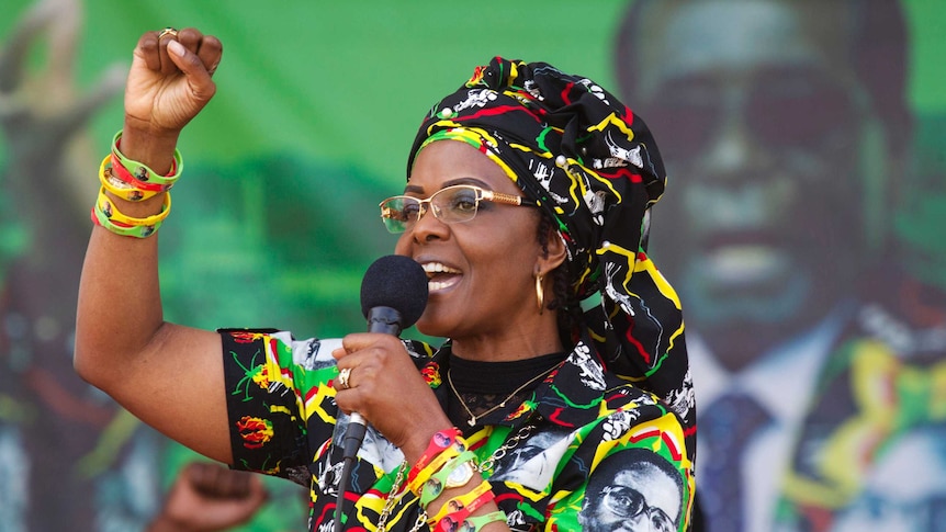 Grace Mugabe raises her first as she addresses supporters.