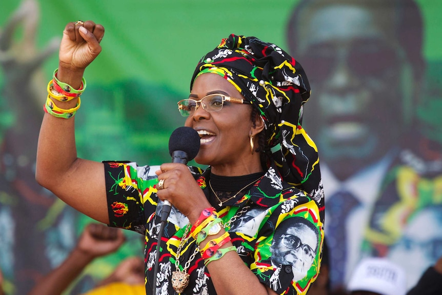 Grace Mugabe raises her first as she addresses supporters.