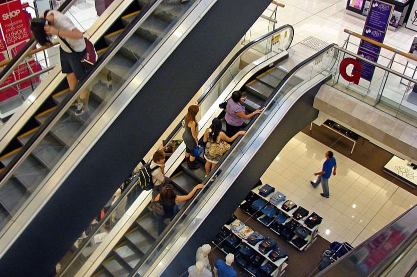 Generic pic of people in an escalator in an apartment store