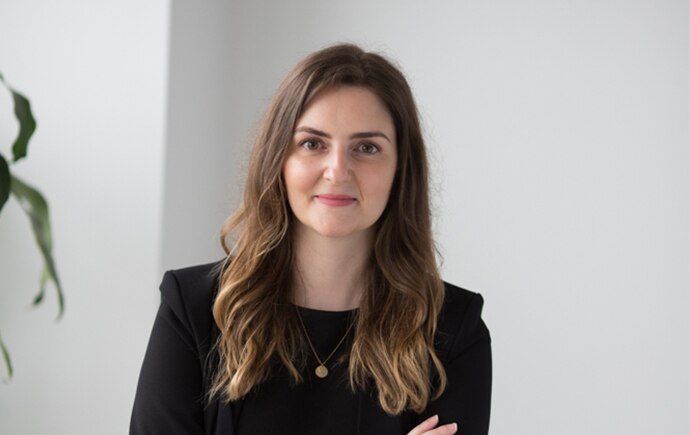 A woman in a dark jacket 