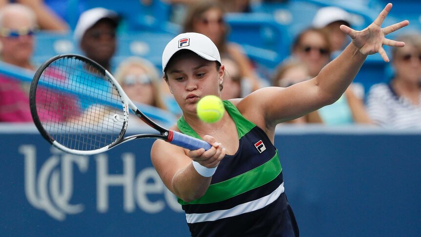 Ash Barty concentrates to return a serve on the forehand.