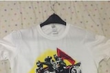 An image of a white T-shirt with motif for a Korean band with a picture of a hot rod and five band members.