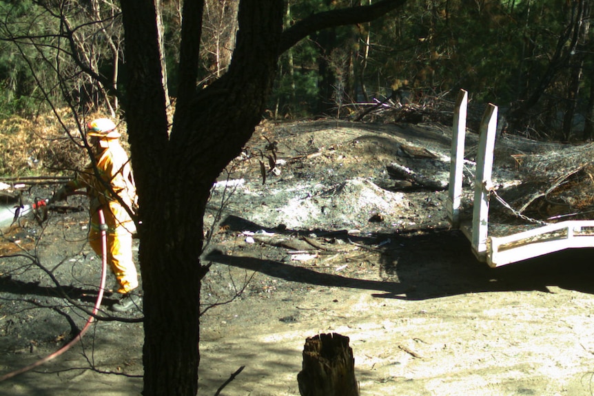 A firefighter extinguished the fires Mr Caldwell lit to burn rubbish.